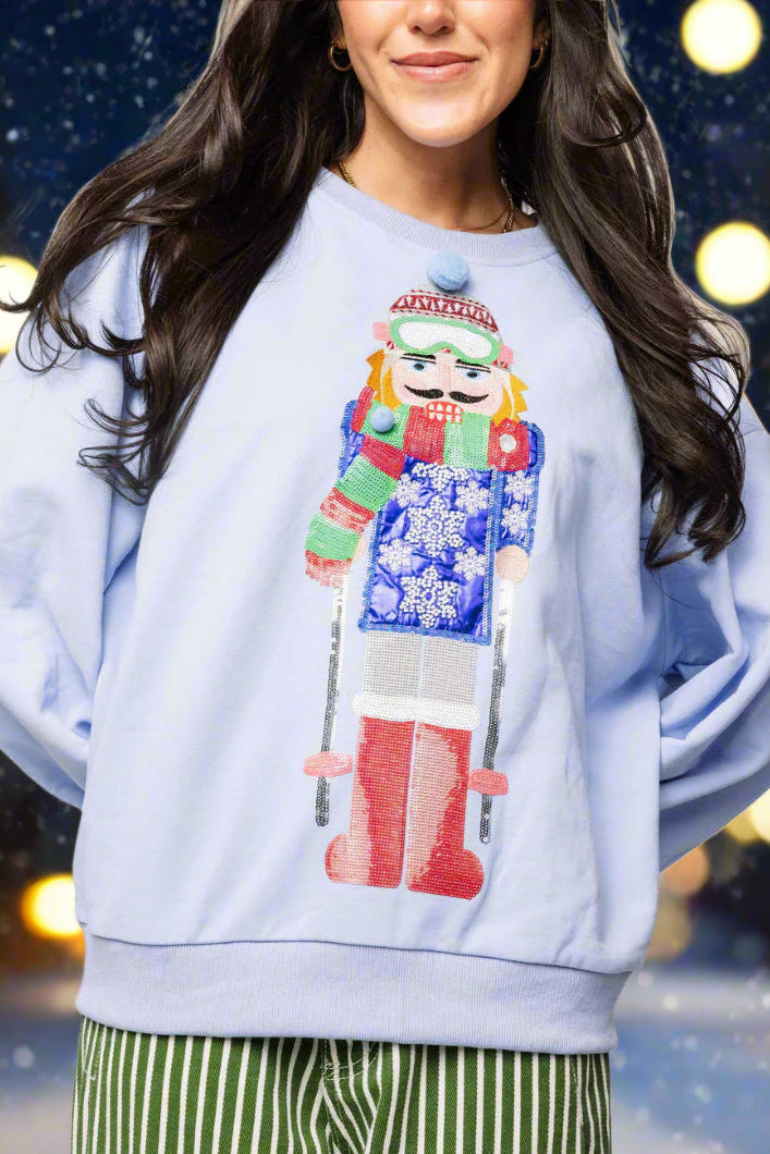 Queen of Sparkles Powder Blue Skiing Nutcracker Sweatshirt-Tops-Queen Of Sparkles-Deja Nu Boutique, Women's Fashion Boutique in Lampasas, Texas