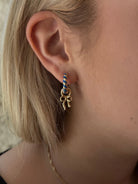 Canvas Style Amber Twisted Blue Enamel Huggie Hoops In Shiny Gold Plated-charm earring-Canvas Style-Deja Nu Boutique, Women's Fashion Boutique in Lampasas, Texas