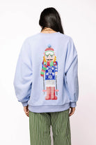 Queen of Sparkles Powder Blue Skiing Nutcracker Sweatshirt-Tops-Queen Of Sparkles-Deja Nu Boutique, Women's Fashion Boutique in Lampasas, Texas