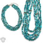 Pink Panache Afghan turquoise multi-strand necklace with 18K gold dipped bead accents and layered turquoise strands.